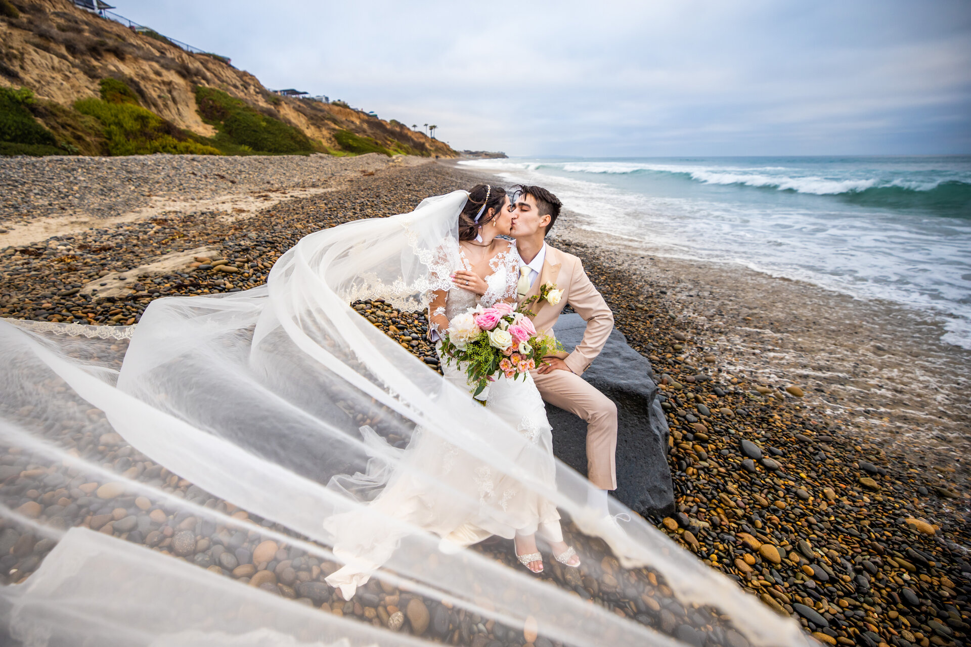 wedding couple kissing on beach